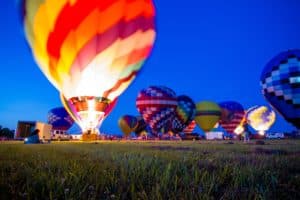 Hot air balloon tethered and lit up