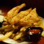 Fried Fish over Fried Potatoes