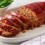 meatloaf with glaze on white dish