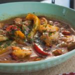 Shrimp and gravy in green bowl