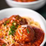 Meatballs and tomato sauce over spaghetti