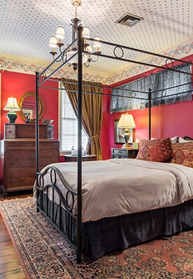 Red Room with Queen-size wrought iron bed and red walls